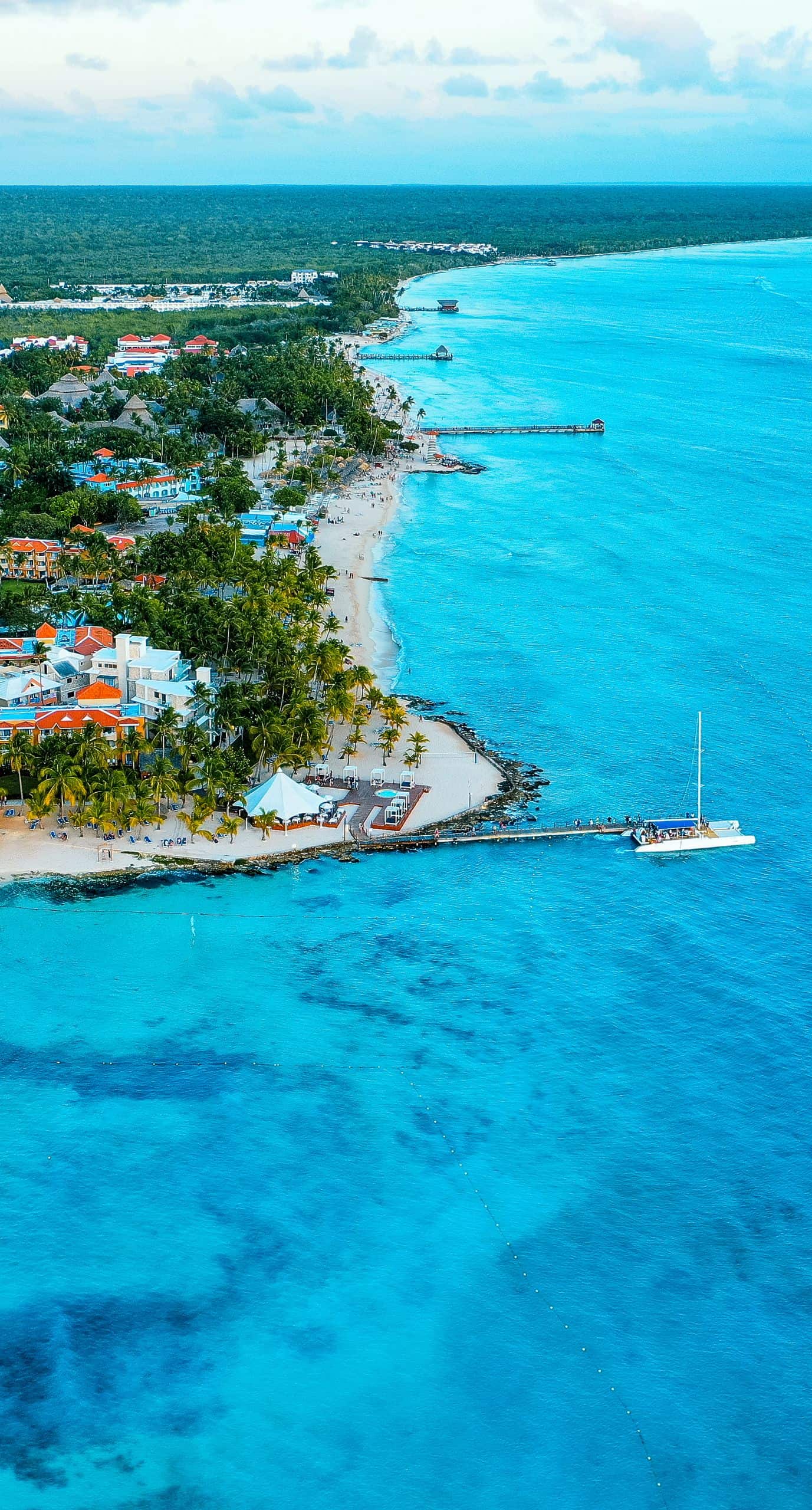 Stunning aerial view of Bayahíbe's turquoise coastline and resort area in the Dominican Republic.